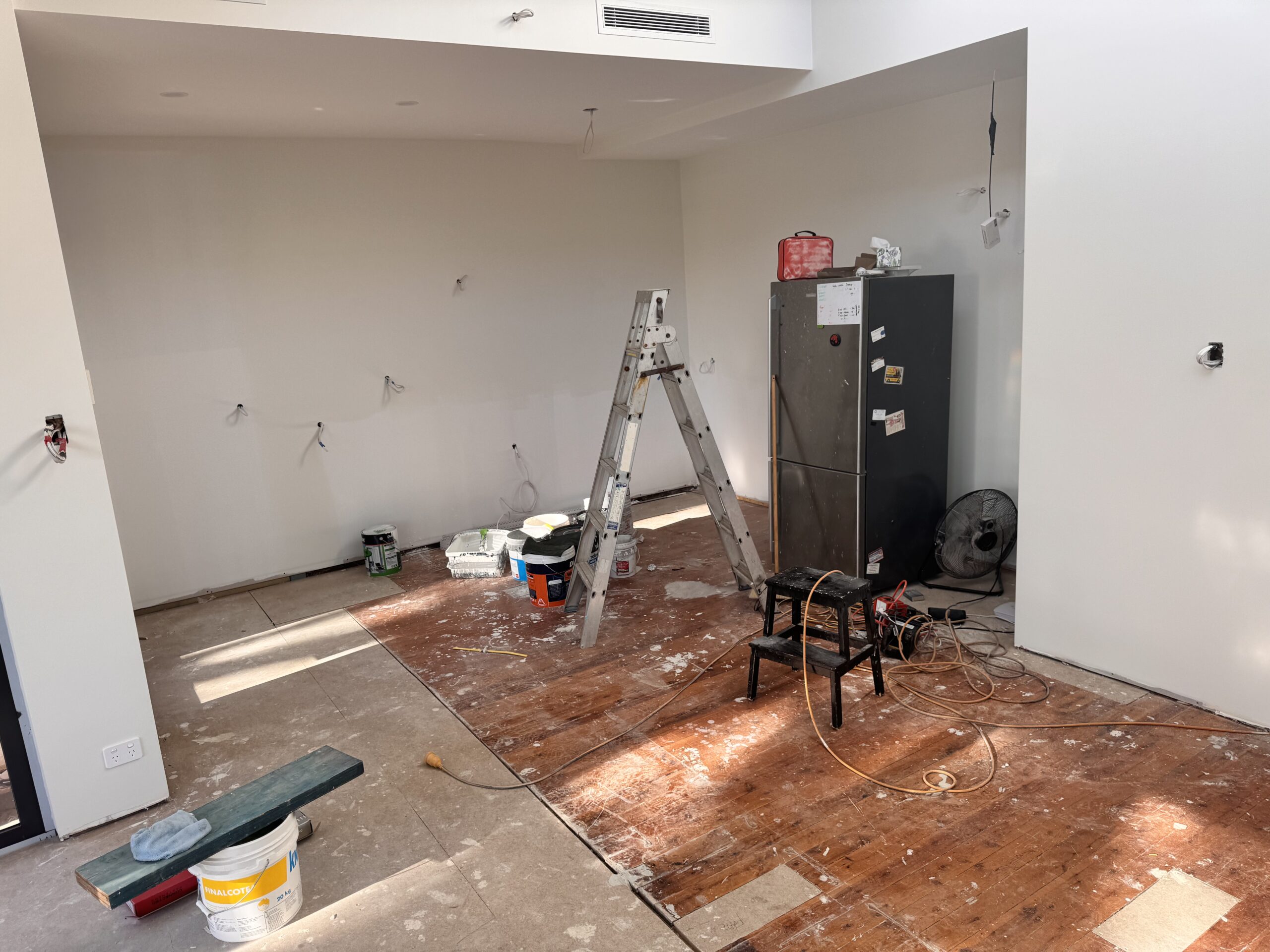 Bare flooring and electrical rough-in for new kitchen installation