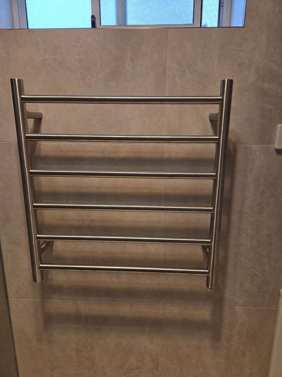 Stainless steel towel rail in renovated Sylvania Waters bathroom