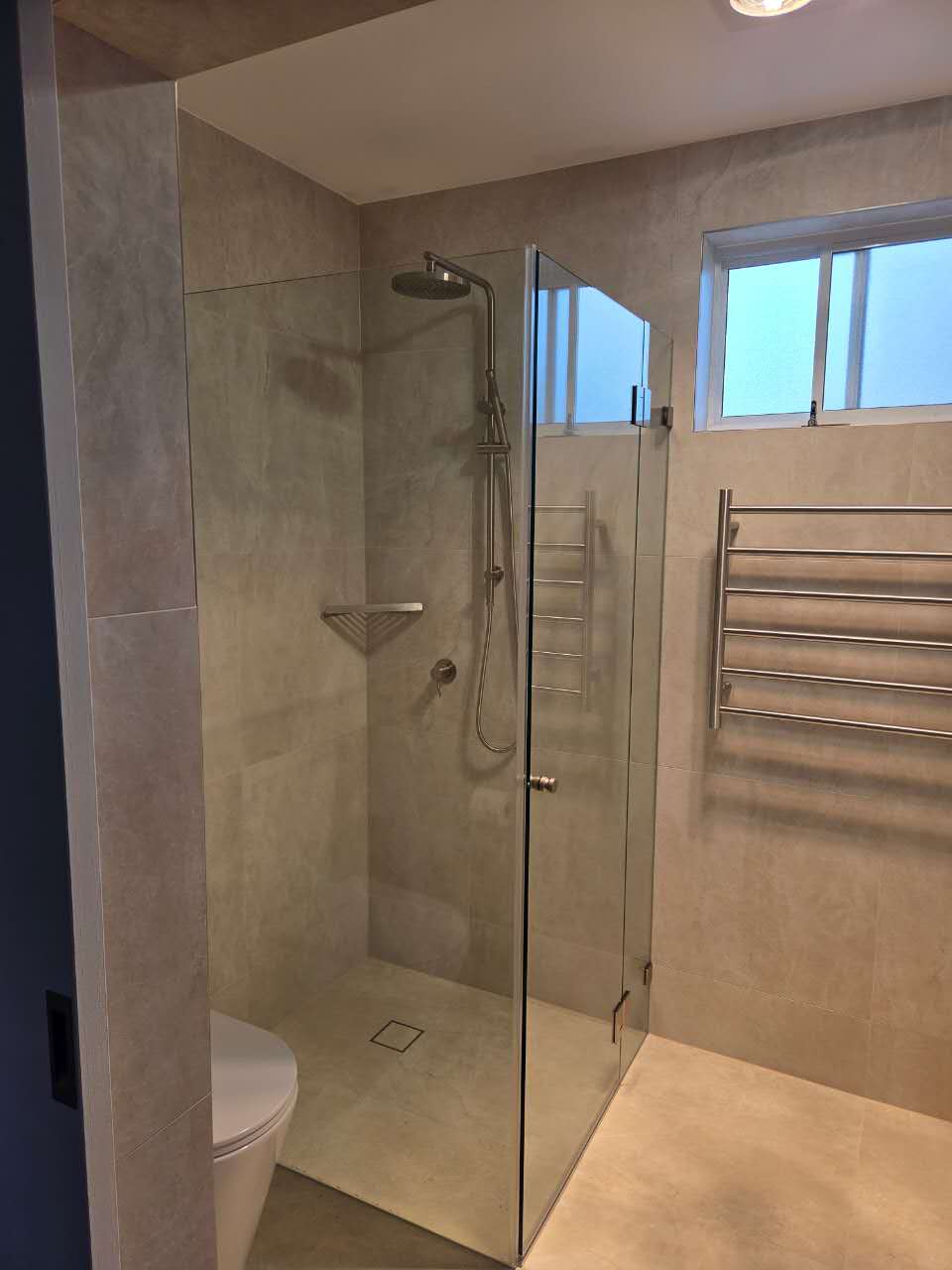 Completed Sylvania Waters bathroom renovation with frameless glass shower by Apex Renovation